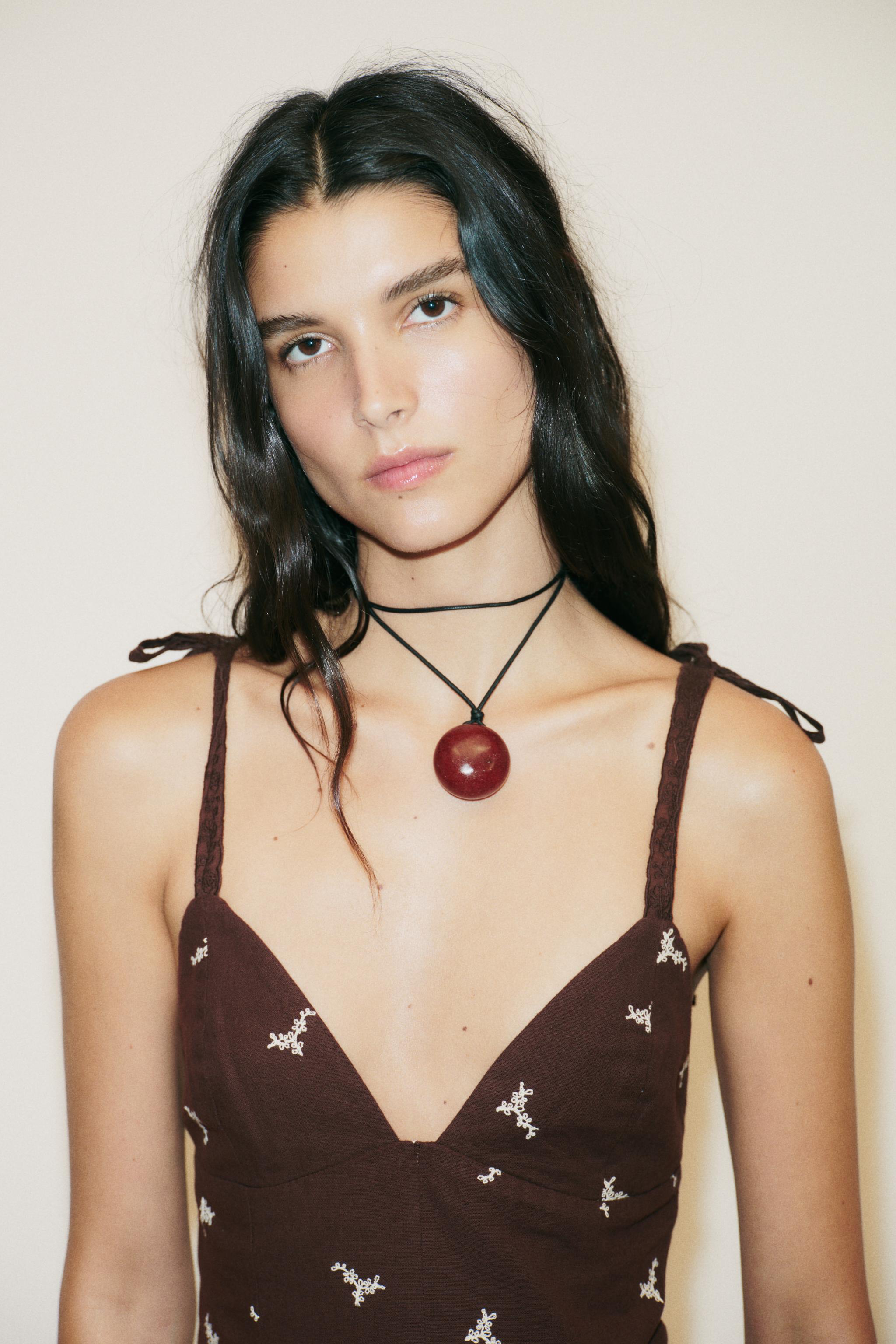 EMBROIDERED PEPLUM TOP